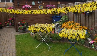 all helmet covers drying in the sun